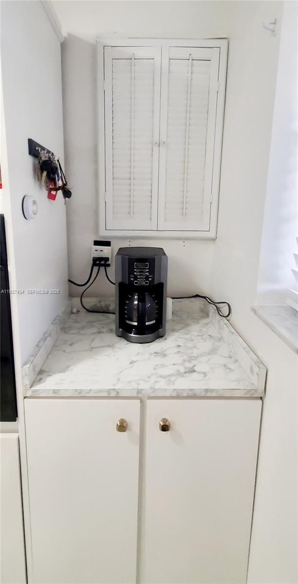 3905 North Nob Hill Road, Unit 510 Sunrise, FL 33351 - Photo 27 of 60 a kitchen with a sink and cabinets