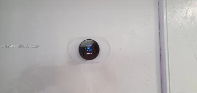 a view of a bedroom with furniture and closet