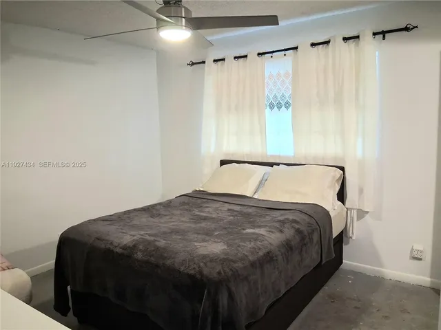 a bathroom with a shower and a toilet