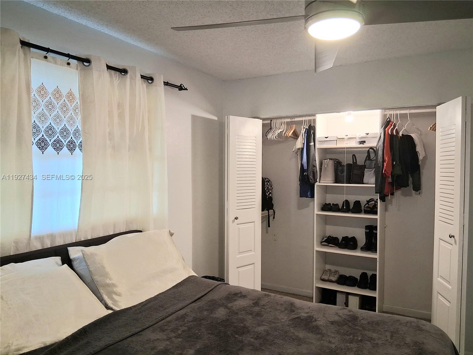 3905 North Nob Hill Road, Unit 510 Sunrise, FL 33351 - Photo 36 of 60 a view of a bedroom with furniture and closet