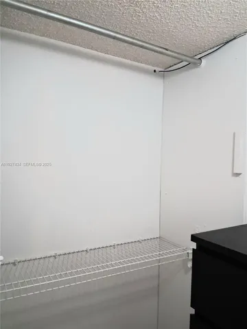 a bathroom with a sink vanity and a mirror