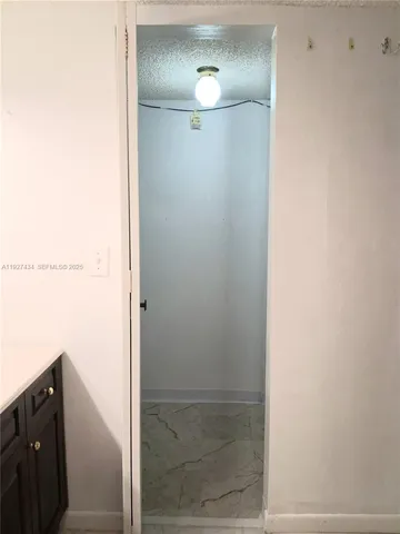 a bedroom with a bed and ceiling fan