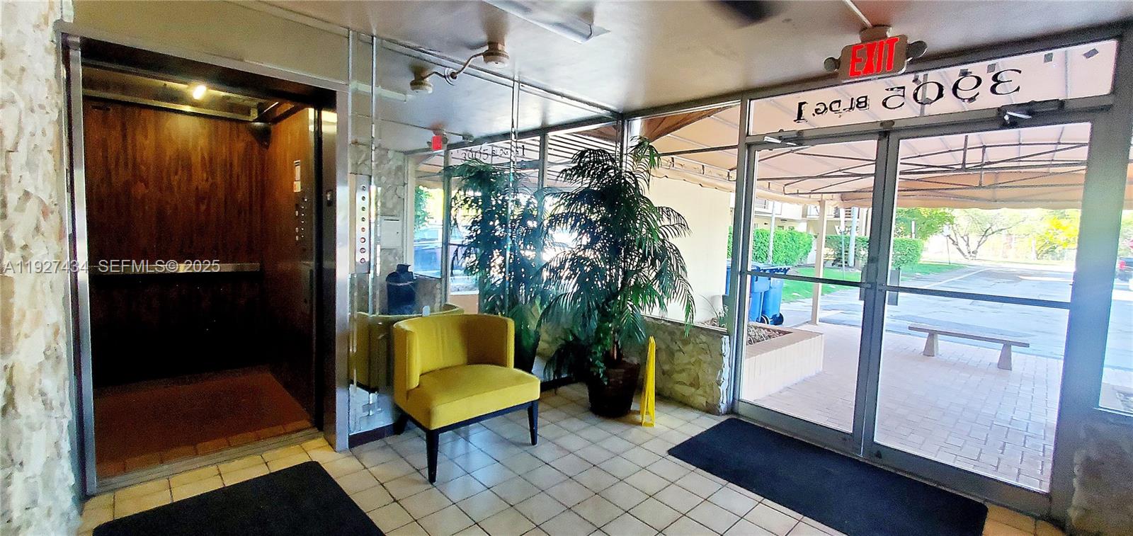 3905 North Nob Hill Road, Unit 510 Sunrise, FL 33351 - Photo 5 of 60 a living room with furniture and a window