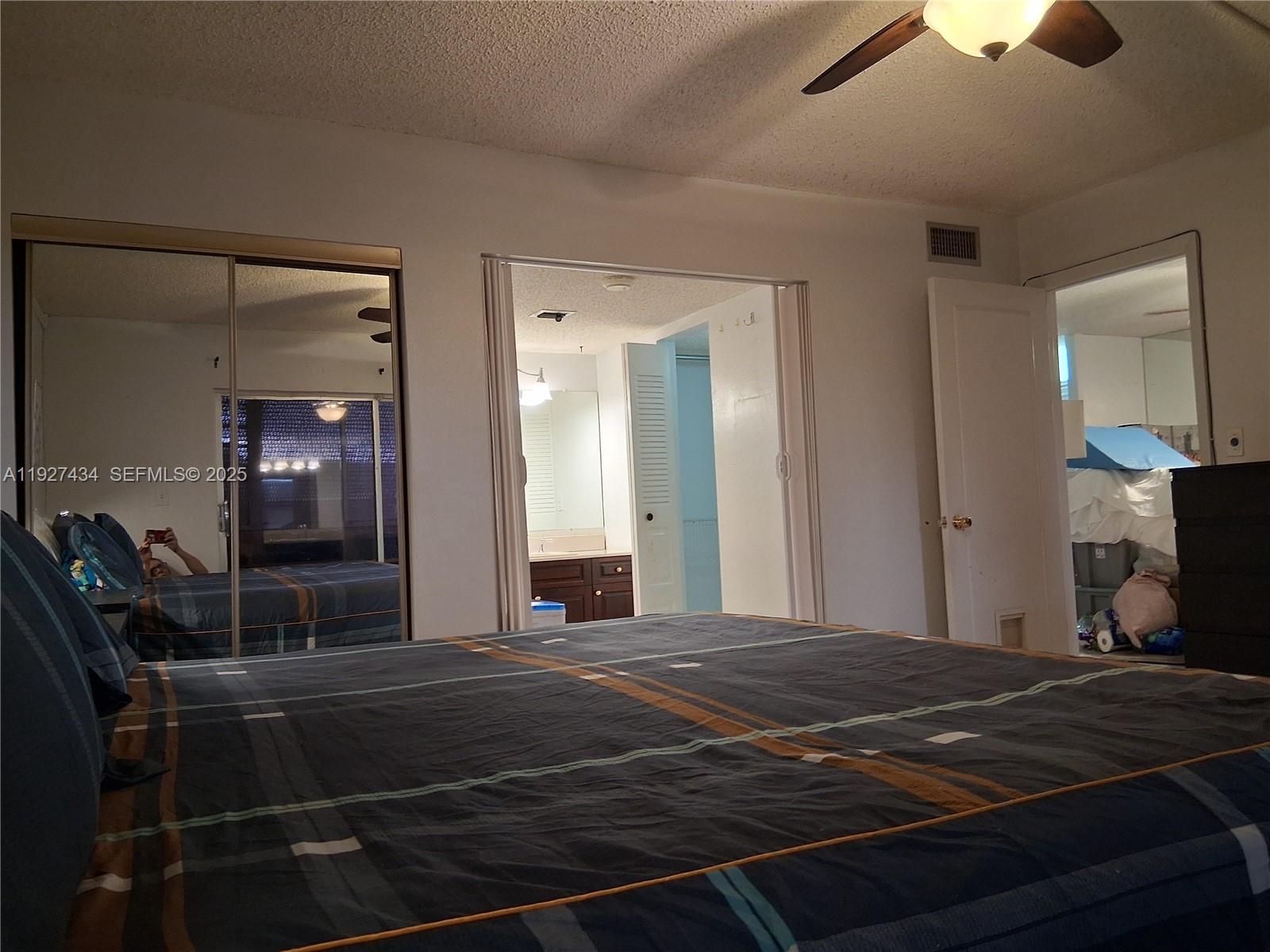 3905 North Nob Hill Road, Unit 510 Sunrise, FL 33351 - Photo 51 of 60 a view of a livingroom with furniture and a chandelier fan