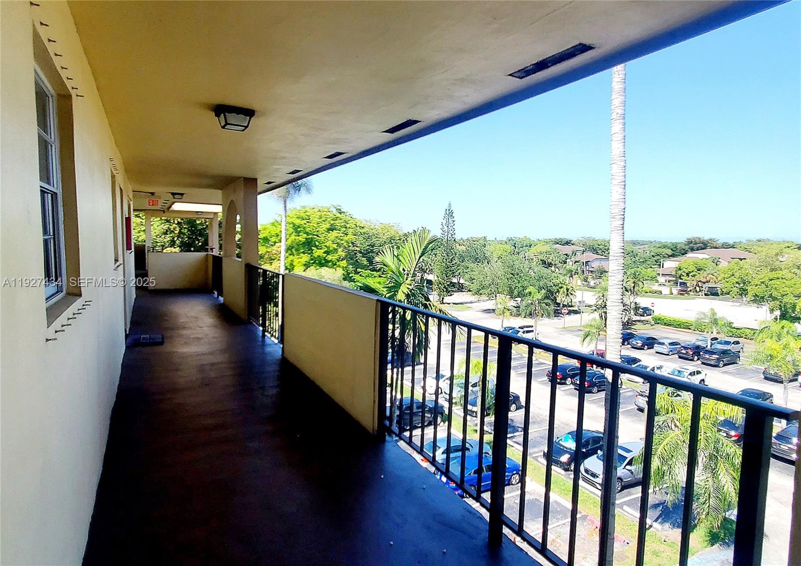 3905 North Nob Hill Road, Unit 510 Sunrise, FL 33351 - Photo 7 of 60 a view of a porch with wooden floor