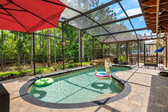 a kitchen with kitchen island granite countertop wooden floors and stainless steel appliances