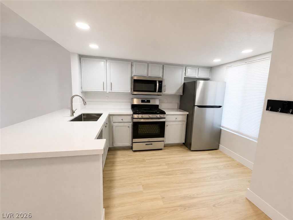 A pristine culinary space awaits with elegant countertops and contemporary stainless steel appliances.