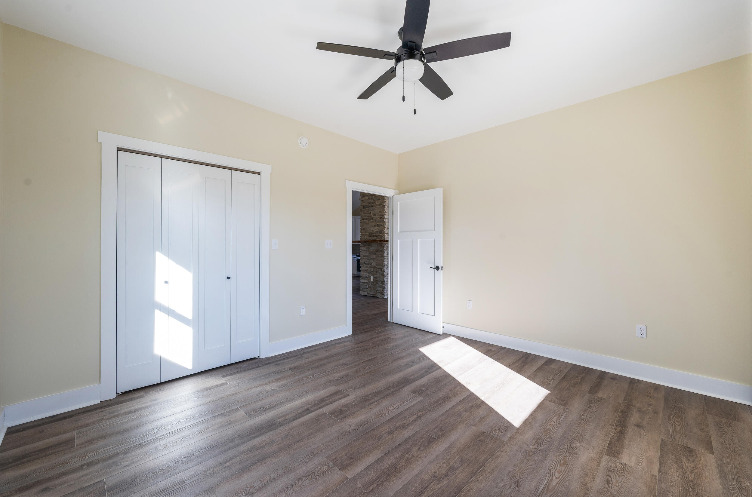 520 Raflo Place Avenue Bedford, VA 24523 - Photo 38 of 54 an empty room with wooden floor and windows