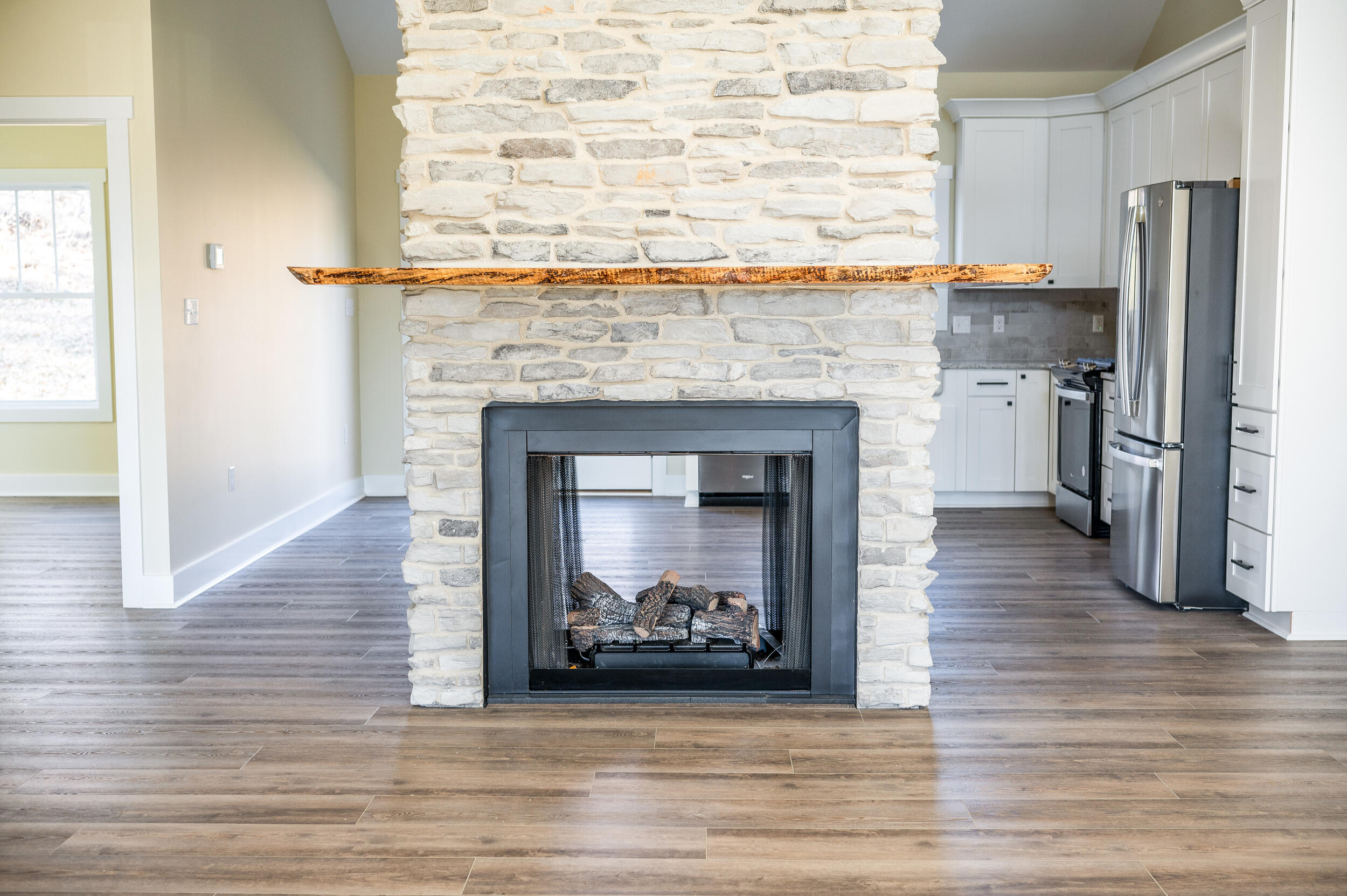 520 Raflo Place Avenue Bedford, VA 24523 - Photo 10 of 54 a living room with a fireplace and a wooden floor