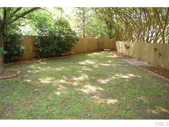 110 Georgetown Road Raleigh, NC 27608 - Photo 13 of 16 a backyard of a house with lots of green space