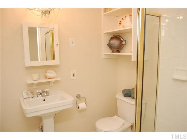 110 Georgetown Road Raleigh, NC 27608 - Photo 16 of 16 a bathroom with a sink and a mirror