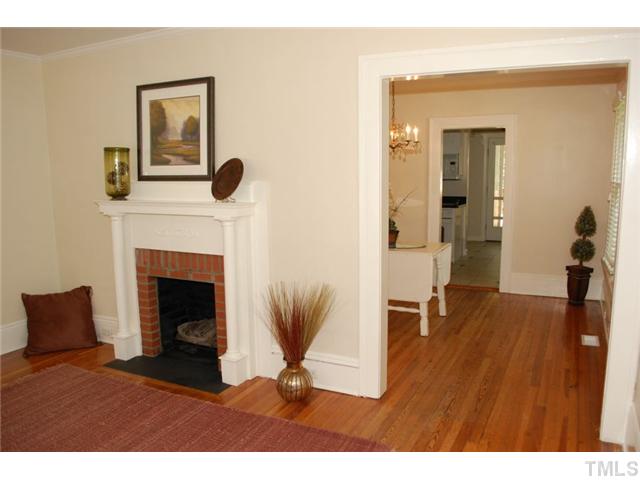 110 Georgetown Road Raleigh, NC 27608 - Photo 4 of 16 a living room with furniture and a fireplace