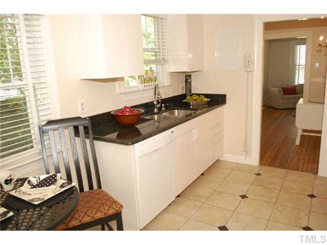 110 Georgetown Road Raleigh, NC 27608 - Photo 9 of 16 a kitchen with a sink and a stove