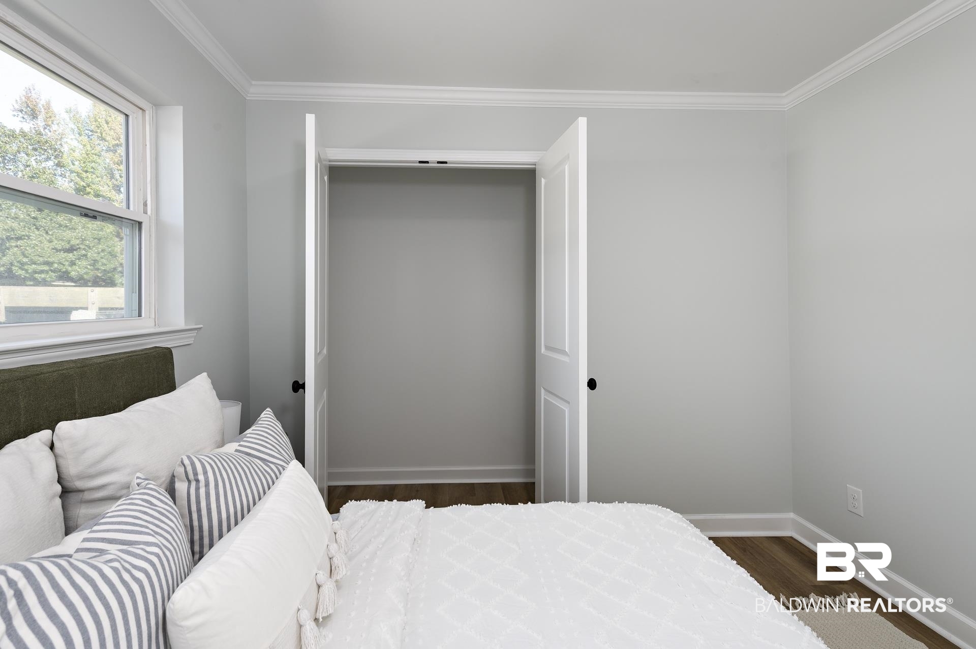 6001 Camp Halls Mill Road Mobile, AL 36619 - Photo 30 of 52 Bedroom featuring dark wood-style flooring and crown molding