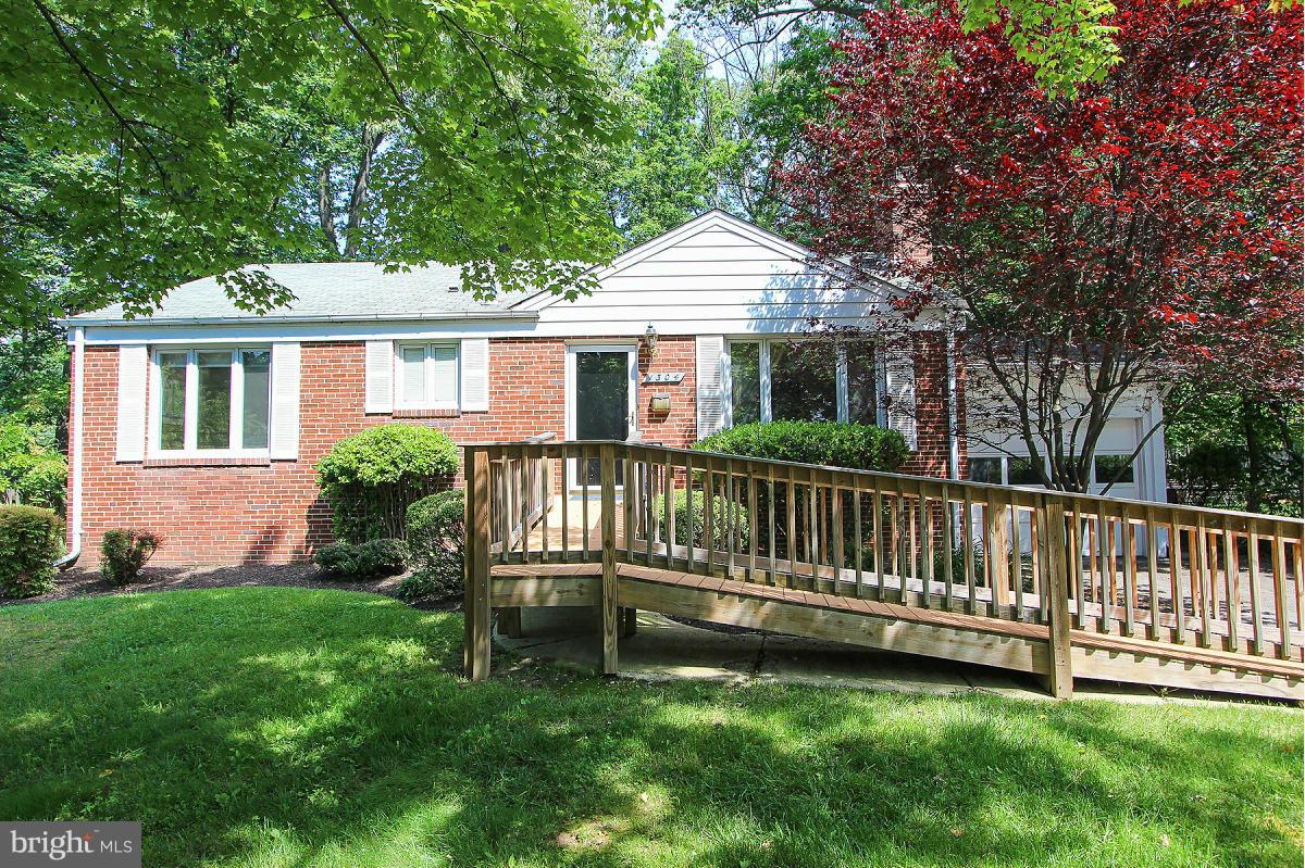 1304 Chalmers Road Silver Spring, MD 20903 - Photo 1 of 19 a view of a house with a yard and a wooden deck