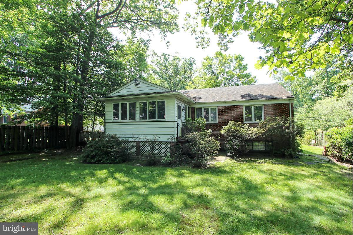 1304 Chalmers Road Silver Spring, MD 20903 - Photo 19 of 19 a front view of a house with a yard