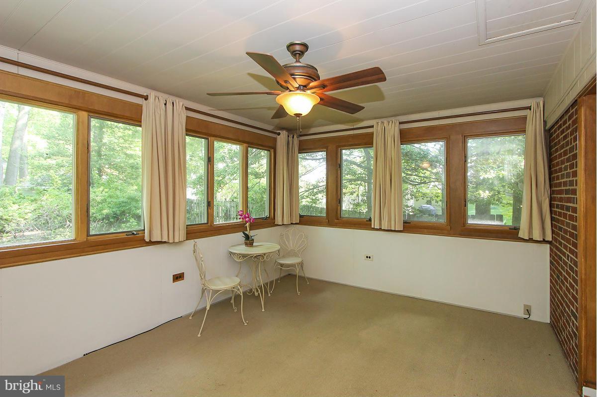 1304 Chalmers Road Silver Spring, MD 20903 - Photo 8 of 19 a living room with furniture and a large window