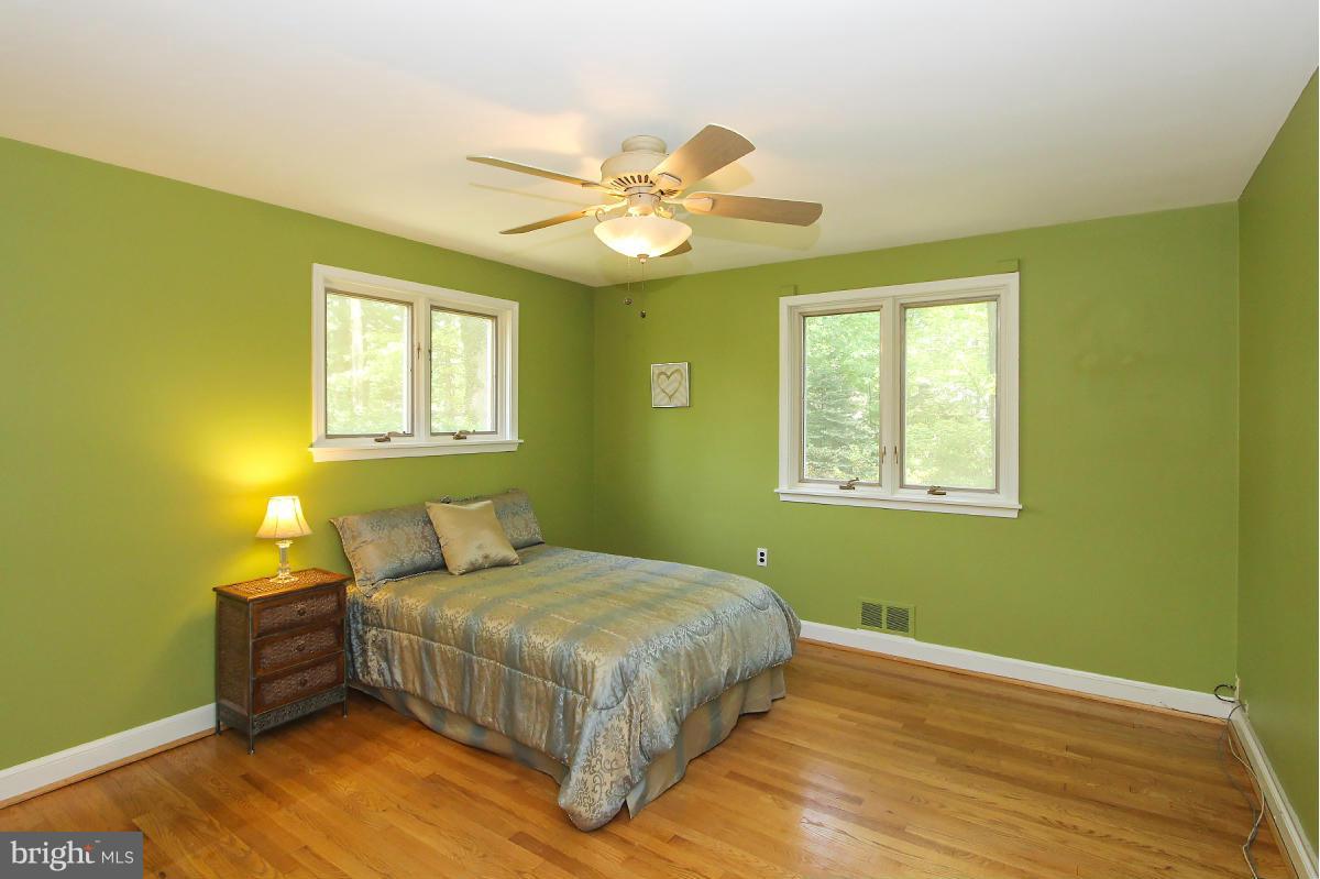 1304 Chalmers Road Silver Spring, MD 20903 - Photo 10 of 19 a bedroom with a bed and a window