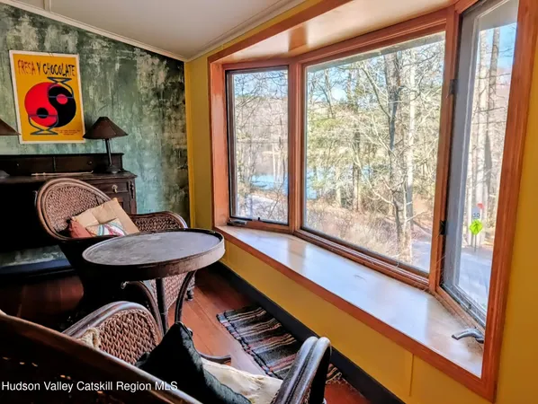 a room with furniture and wooden floor