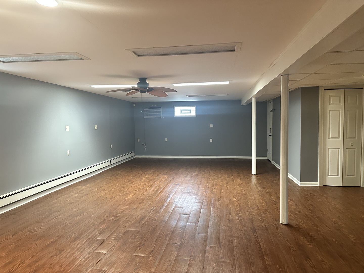 4517 Park Avenue, Unit G Brookfield, IL 60513 - Photo 12 of 12 an empty room with wooden floor and windows