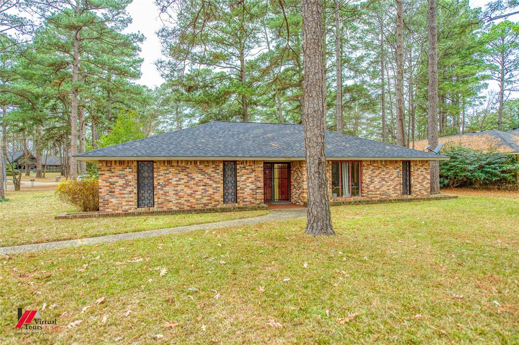 1404 North Acres Circle Springhill, LA 71075 - Photo 1 of 29 View of front of home with a front lawn, brick siding, and a shingled roof