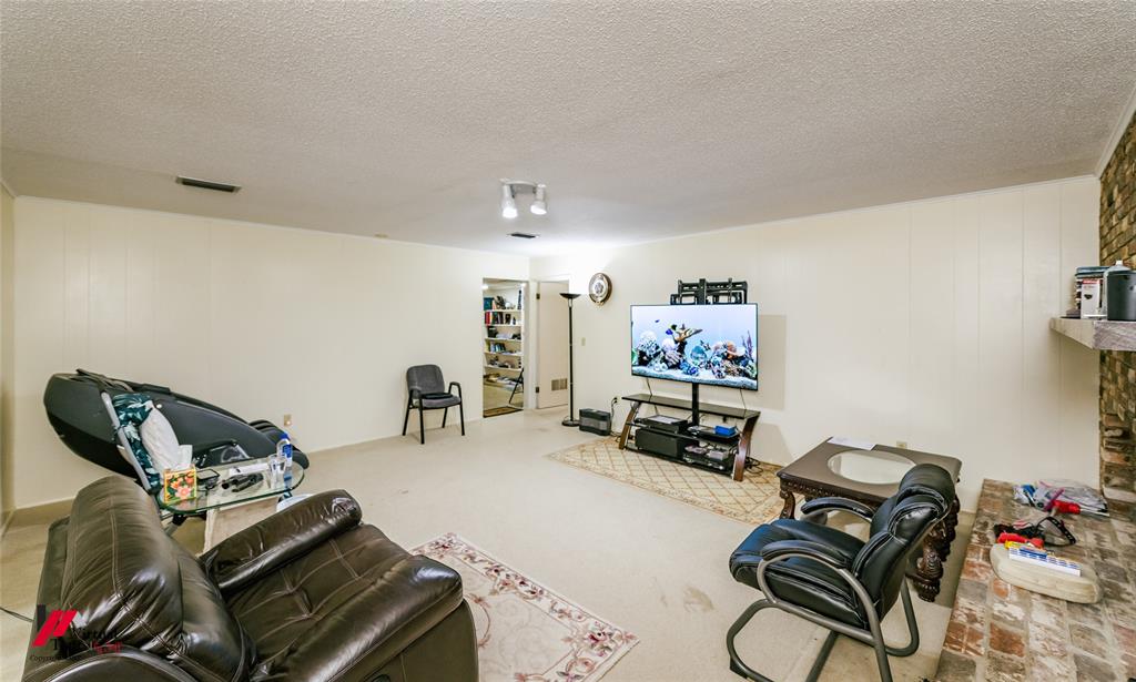 1404 North Acres Circle Springhill, LA 71075 - Photo 18 of 29 Home theater room with a textured ceiling and carpet flooring