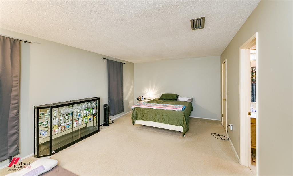 1404 North Acres Circle Springhill, LA 71075 - Photo 22 of 29 Bedroom featuring carpet floors and a textured ceiling