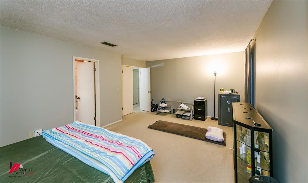 1404 North Acres Circle Springhill, LA 71075 - Photo 23 of 29 Bedroom featuring carpet floors and a textured ceiling