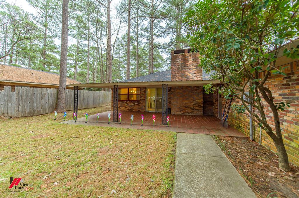 1404 North Acres Circle Springhill, LA 71075 - Photo 6 of 29 Rear view of house featuring brick siding and a patio