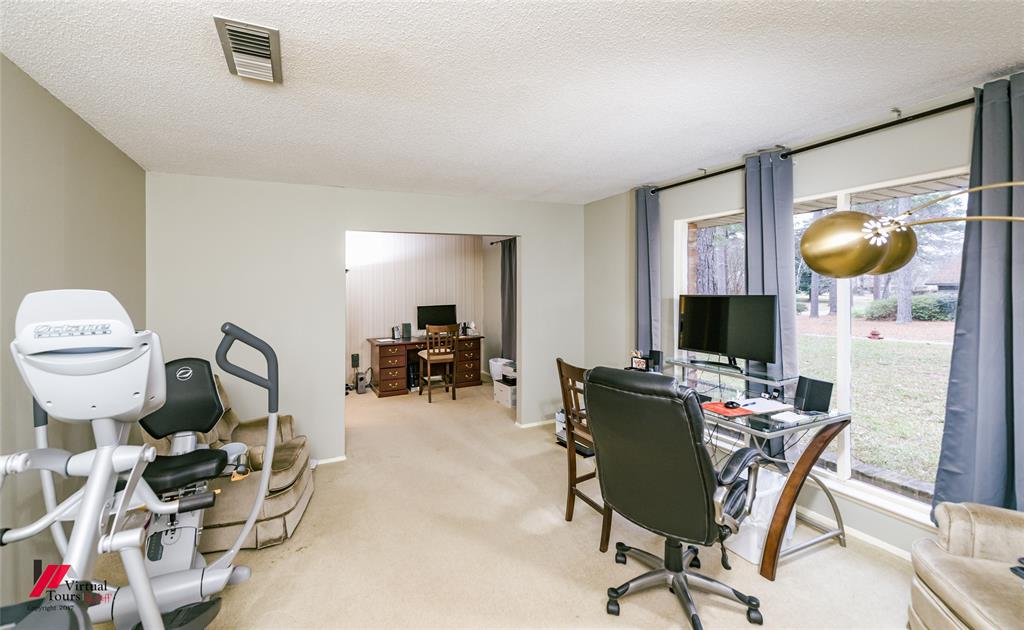 1404 North Acres Circle Springhill, LA 71075 - Photo 7 of 29 Carpeted home office with a textured ceiling