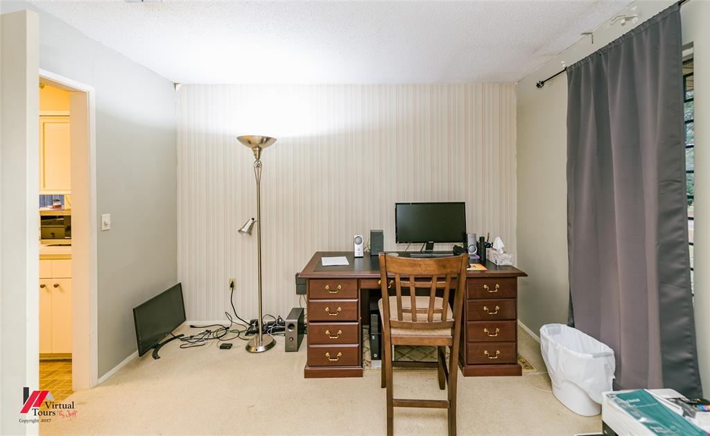 1404 North Acres Circle Springhill, LA 71075 - Photo 9 of 29 Carpeted home office featuring a textured ceiling