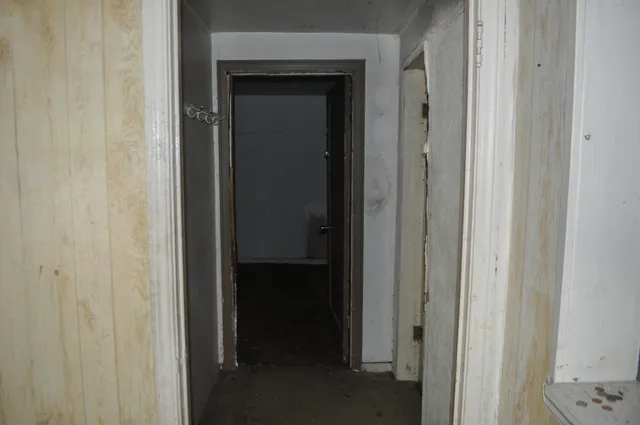 a view of a bathroom from a hallway