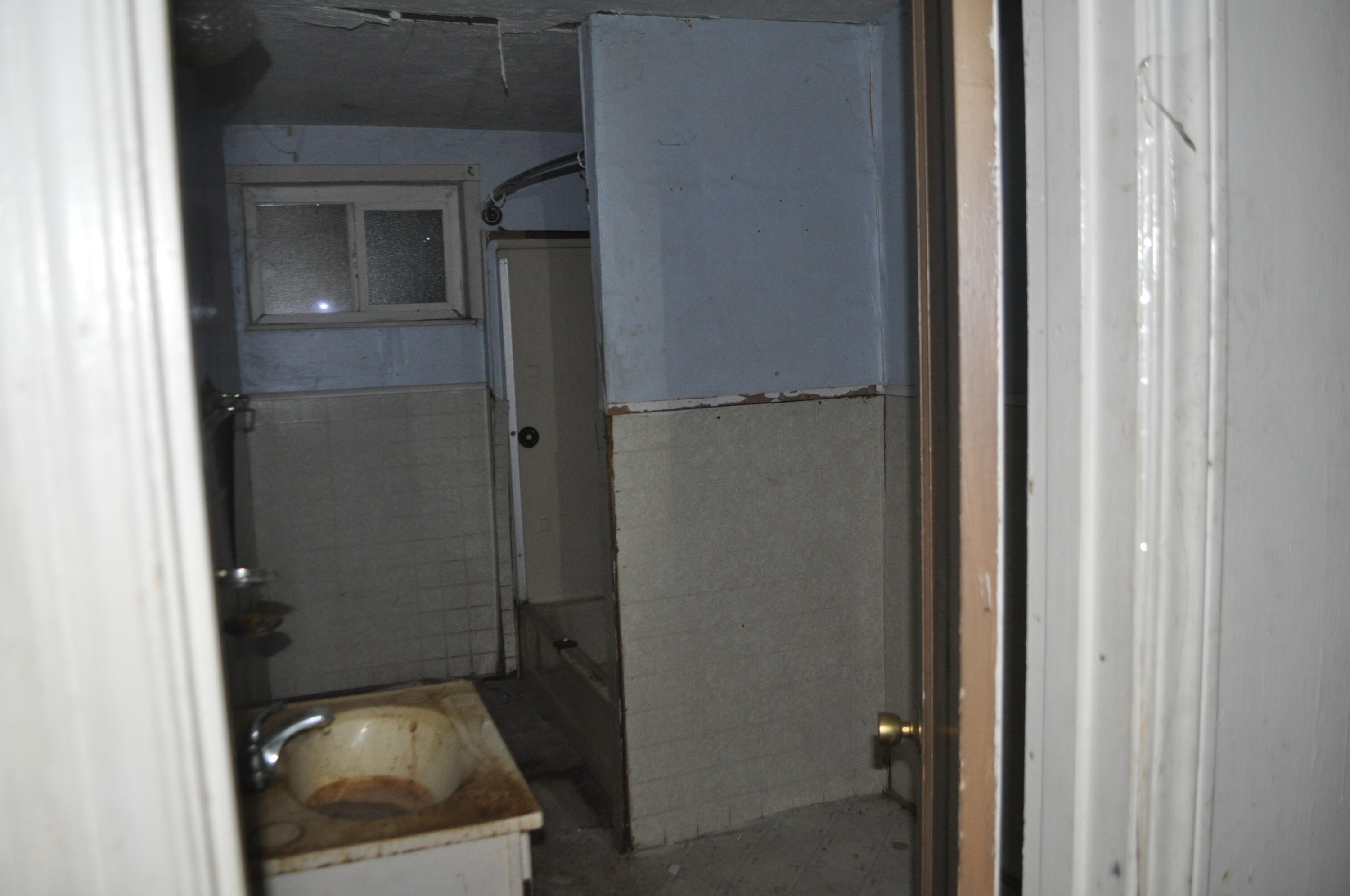 4098 St Patricks Avenue Redding, CA 96003 - Photo 16 of 38 a view of a bathroom from a corridor