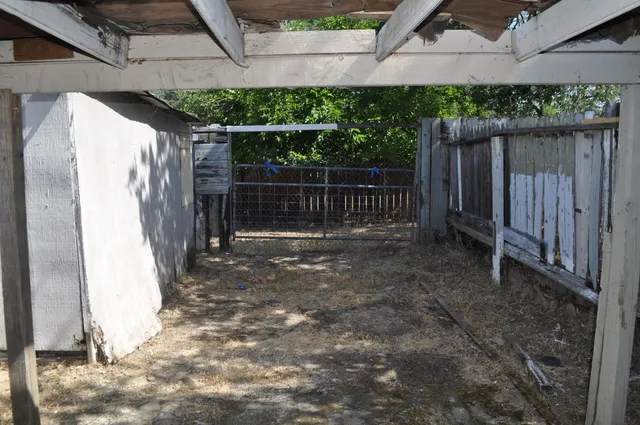 a view of a backyard of the house