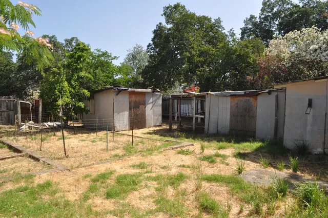 a view of a backyard of the house