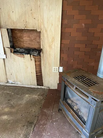 a stove top oven sitting inside of a kitchen