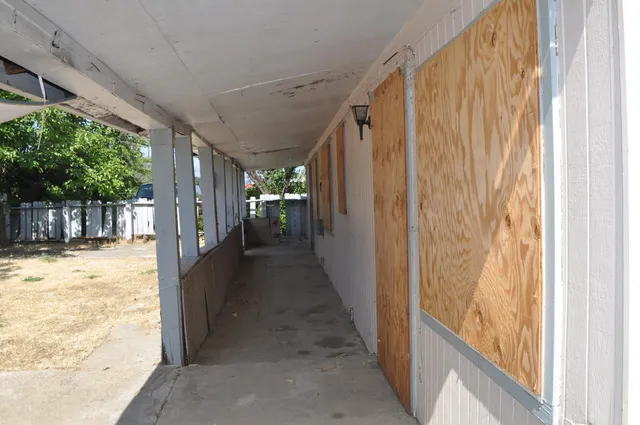 a view of a house with a street