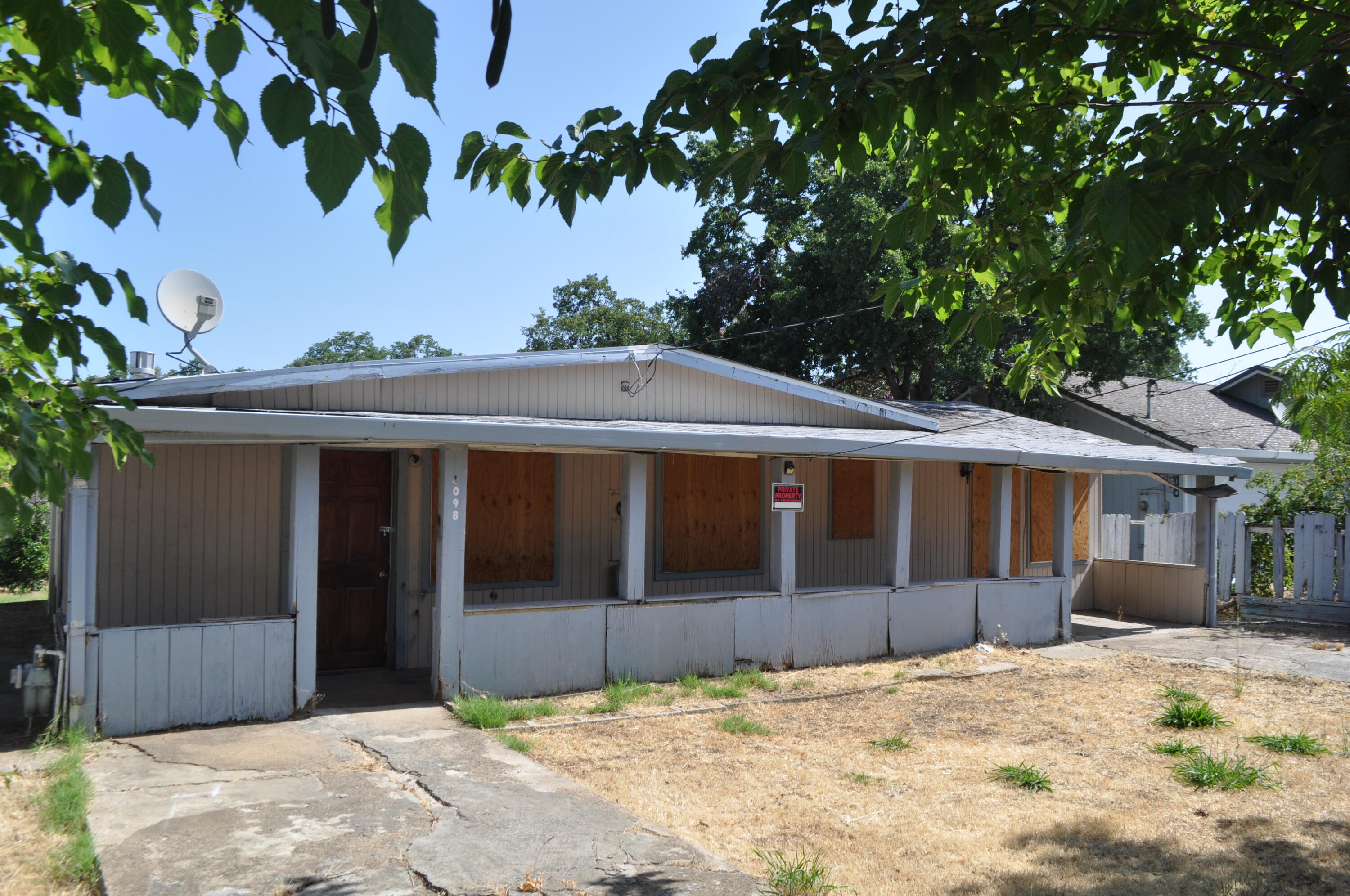 4098 St Patricks Avenue Redding, CA 96003 - Photo 35 of 38 a view of a house with a backyard
