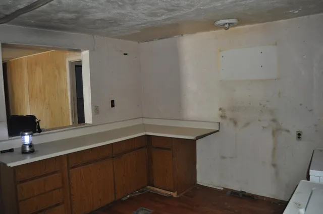 a view of a bathroom from a hallway