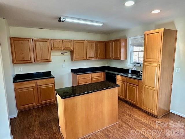 45 Marshbanks Ridge Weaverville, NC 28787 - Photo 14 of 36 a kitchen with granite countertop wooden cabinets a stove a sink a refrigerator and with wooden floor
