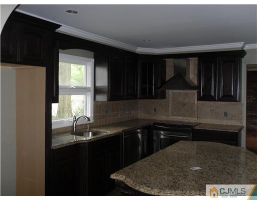 139 South Cliff Road Colonia, NJ 07067 - Photo 3 of 4 a kitchen with a sink and cabinets
