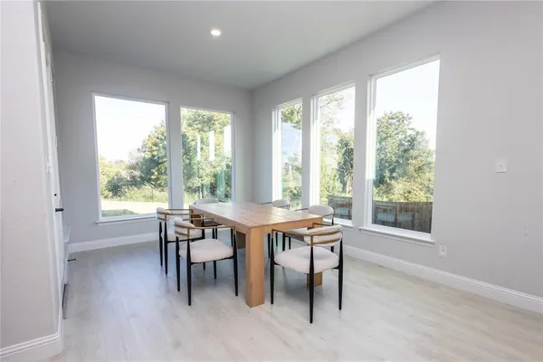a view of a dining room with furniture window and outside view