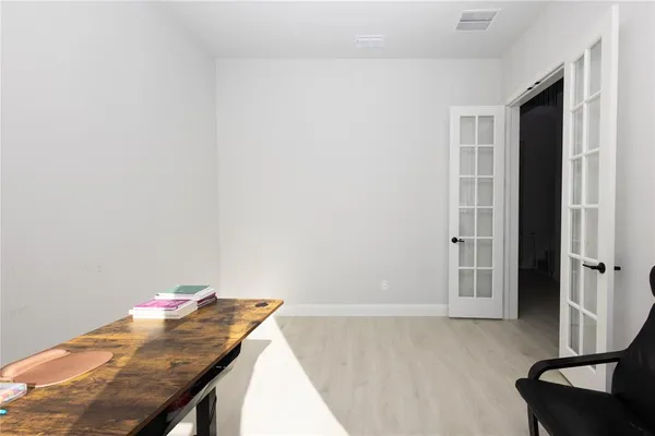 a room with a table and chairs