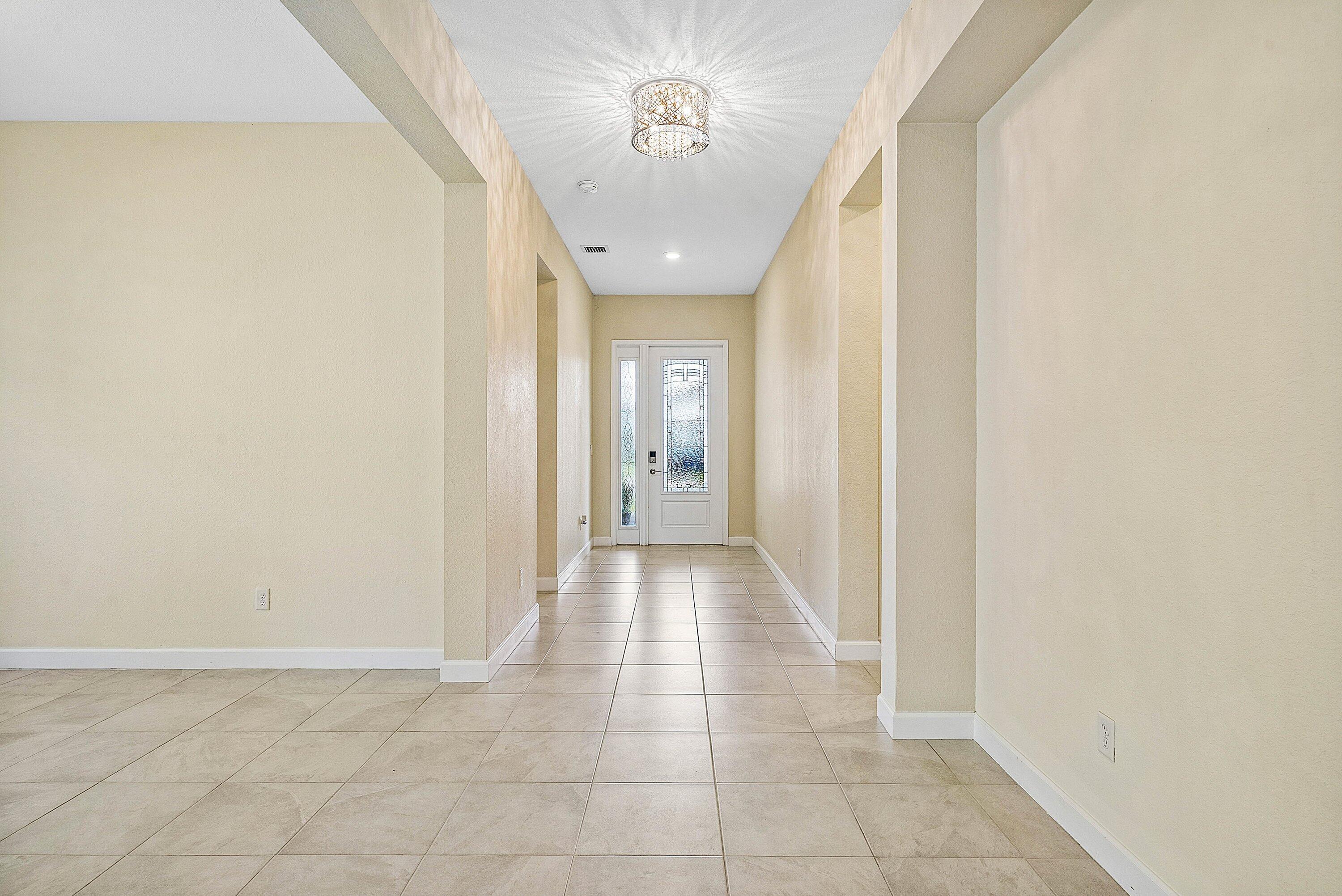 1031 Ember Ridge Run Loxahatchee, FL 33470 - Photo 16 of 52 a view of a hallway