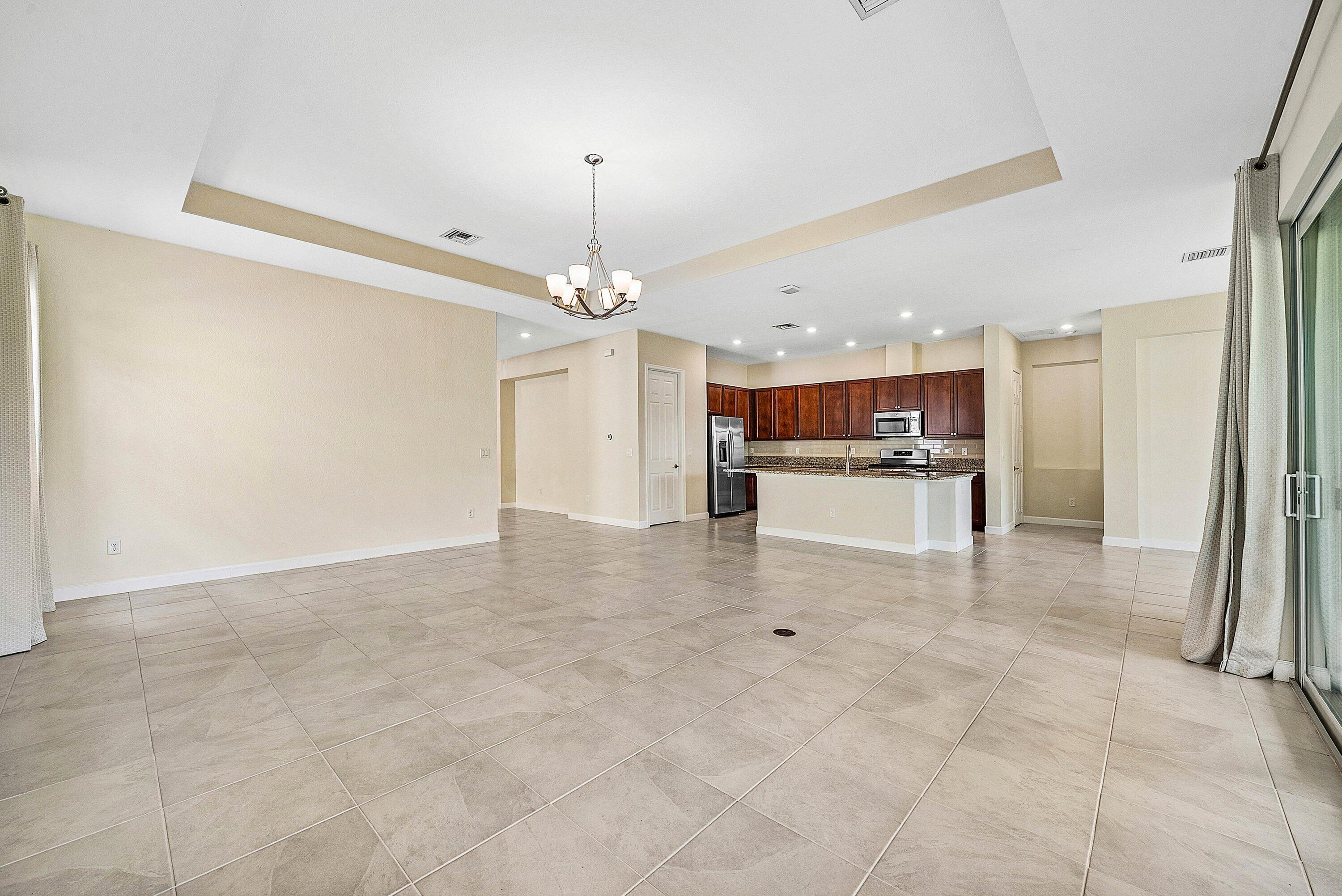 1031 Ember Ridge Run Loxahatchee, FL 33470 - Photo 21 of 52 a view of kitchen with refrigerator and cabinets