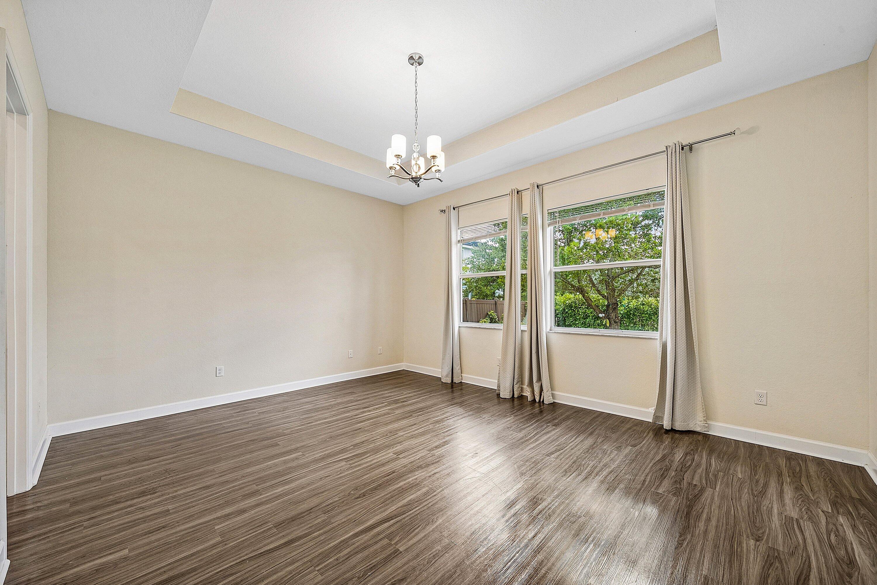 1031 Ember Ridge Run Loxahatchee, FL 33470 - Photo 28 of 52 a view of livingroom with window hardwood floor and ceiling window
