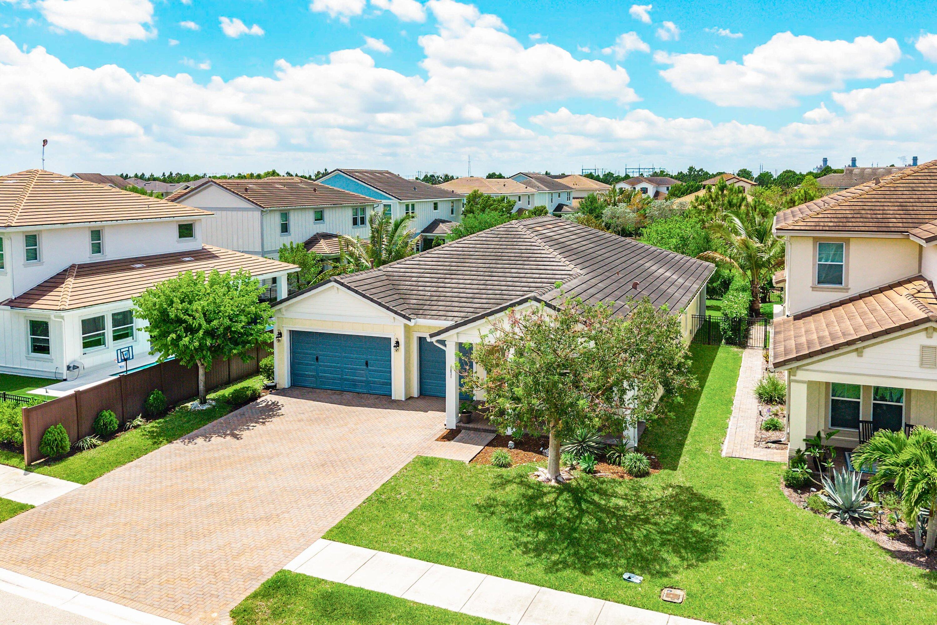 1031 Ember Ridge Run Loxahatchee, FL 33470 - Photo 40 of 52 a aerial view of a house with a yard