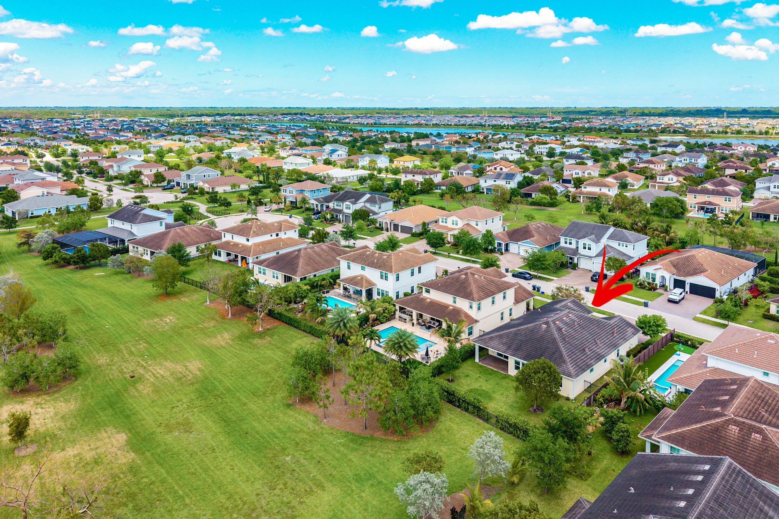 1031 Ember Ridge Run Loxahatchee, FL 33470 - Photo 47 of 52 an aerial view of residential houses with outdoor space and trees all around