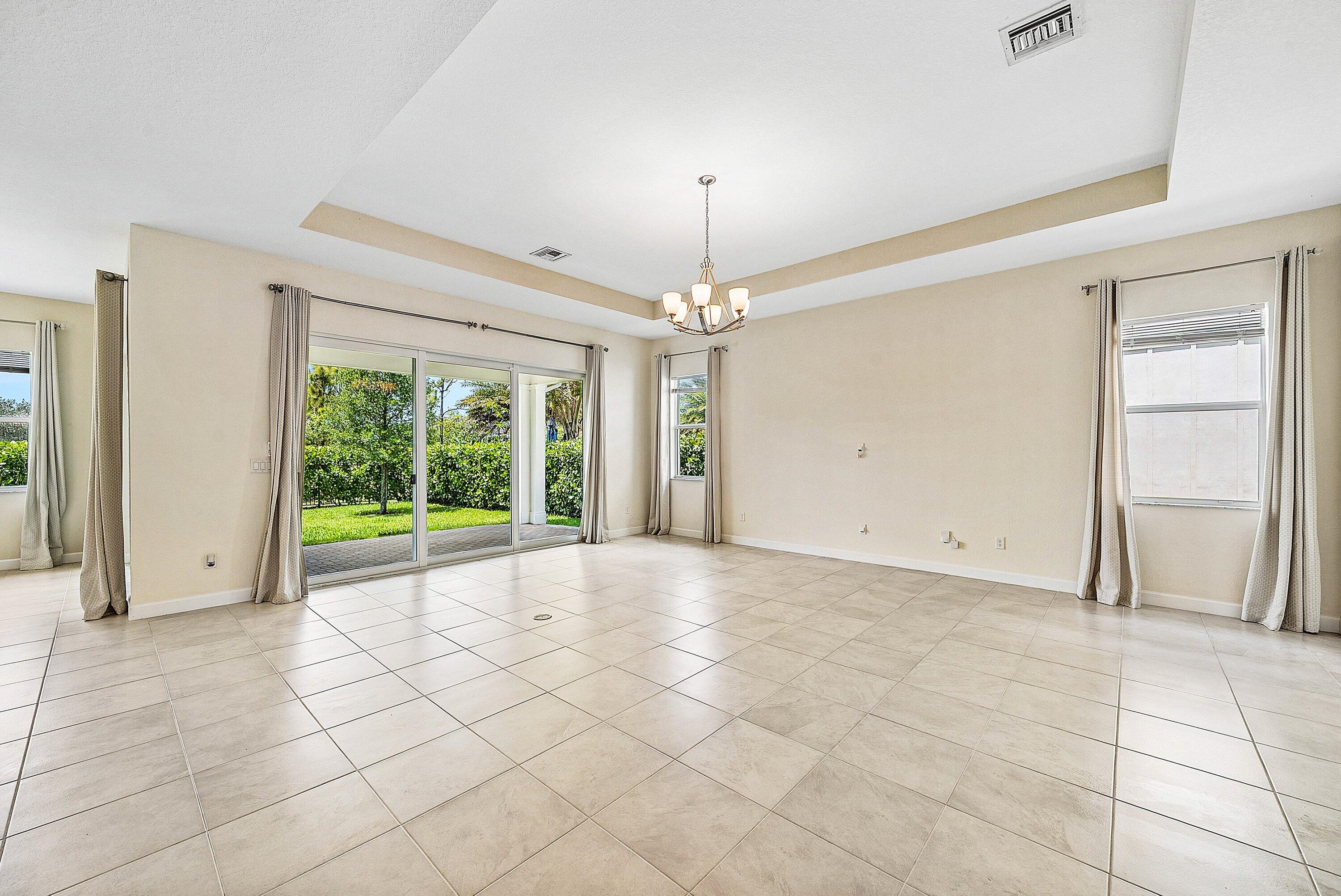 1031 Ember Ridge Run Loxahatchee, FL 33470 - Photo 5 of 52 a view of an empty room with a window