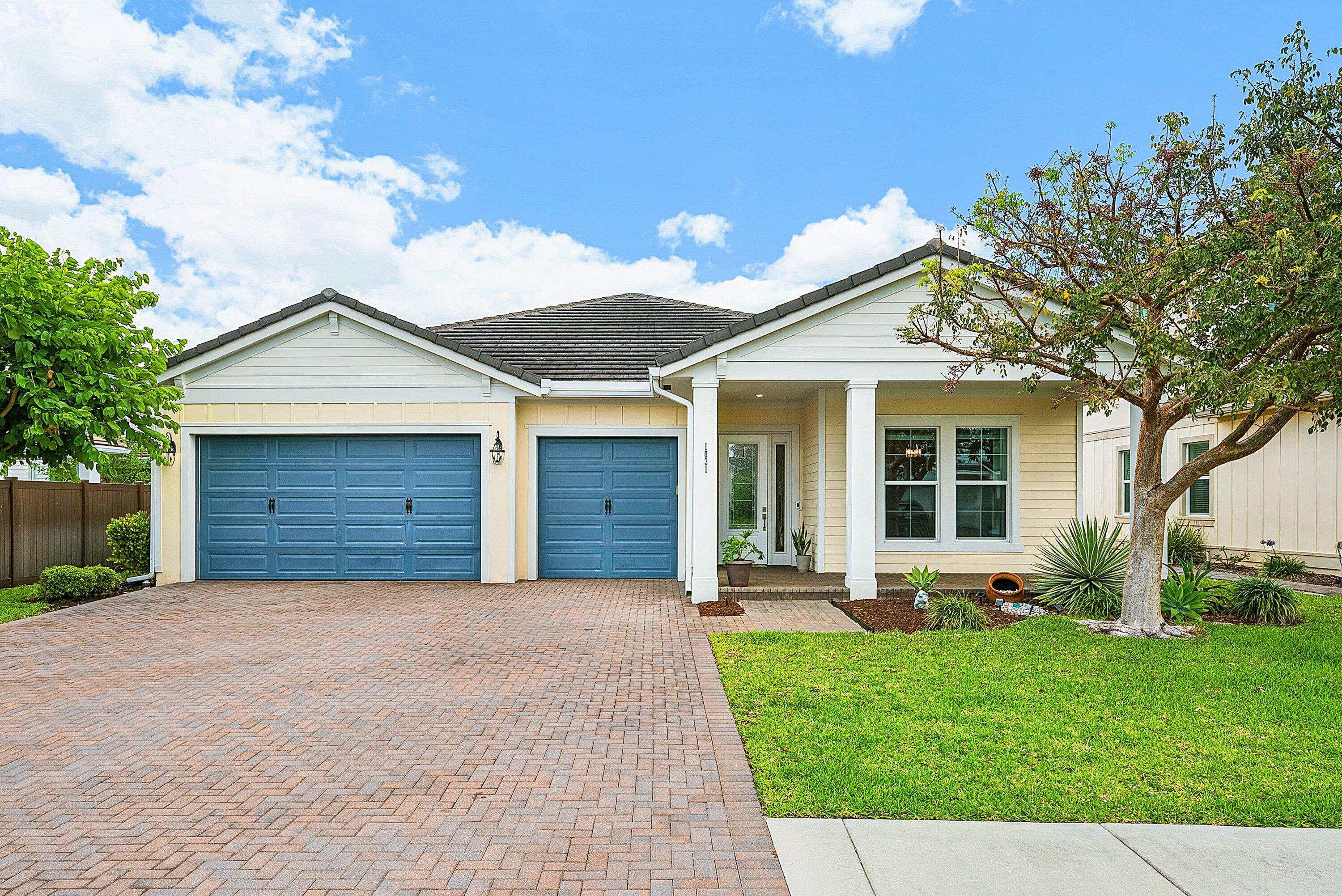 1031 Ember Ridge Run Loxahatchee, FL 33470 - Photo 51 of 52 a front view of house with yard and green space